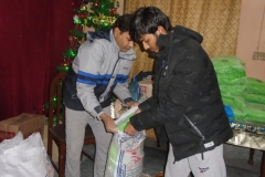 Paster-Pervaiz-and-brother-Joseph-creating-bags-to-give-away